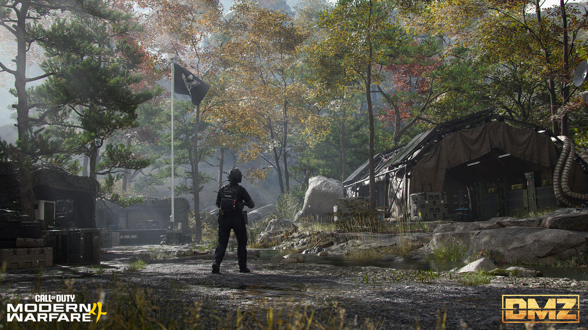 An Operator walks through the FOB camp in a pine forest