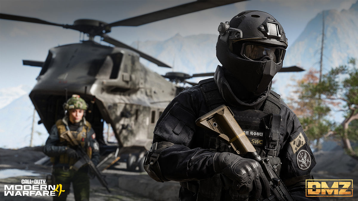 Two Operators in front of the transport helicopter at the FOB