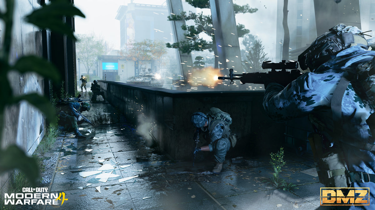 A squad fights through a rainy city plaza