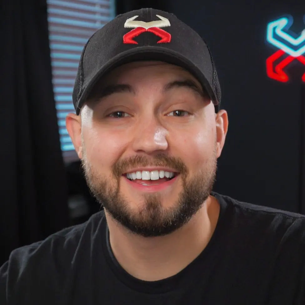 Corbin 'Expel' Rhymer in his office, the Expel neon sign behind him